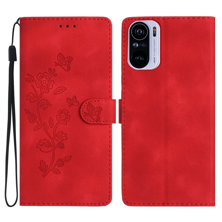 Red leather phone case with embossed flower and butterfly pattern, magnetic flap