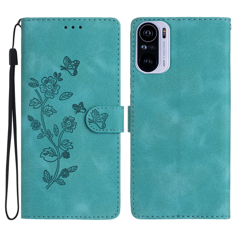 Turquoise leather phone case with embossed flower and butterfly pattern, magnetic flap