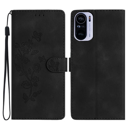 Dark black leather phone case with embossed flower and butterfly pattern, magnetic flap