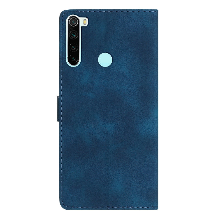 Blue leather phone case with camera and speaker cutouts and round light-blue logo