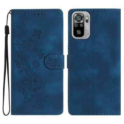 Blue leather wallet phone case with embossed butterfly-and-flower pattern and wrist strap