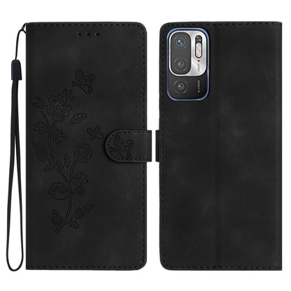 Black leather wallet phone case with embossed butterfly-and-flower pattern and wrist strap