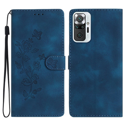 Blue flip wallet phone case with embossed butterflies and flowers, with wrist strap