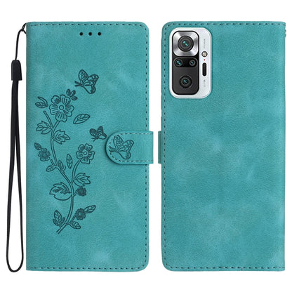 Teal leather phone case with embossed flower and butterfly pattern, magnetic flap