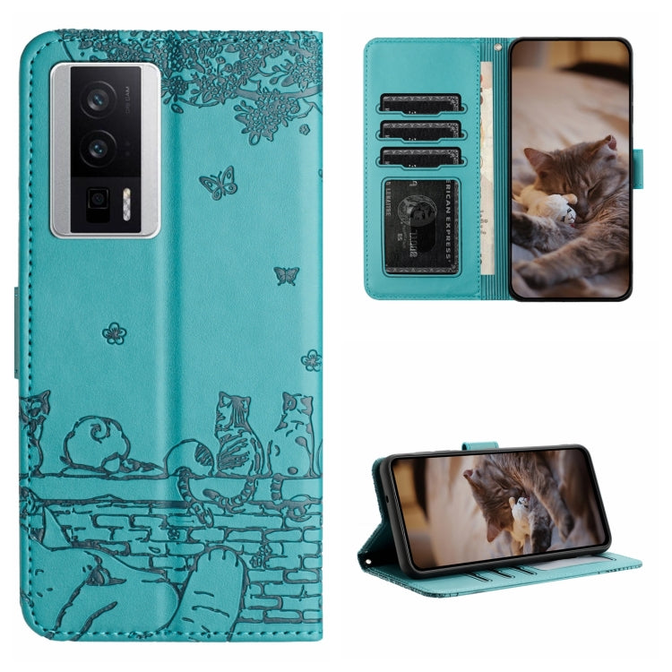 Teal cat-embossed leather-style folio phone case with lanyard and card slots.
