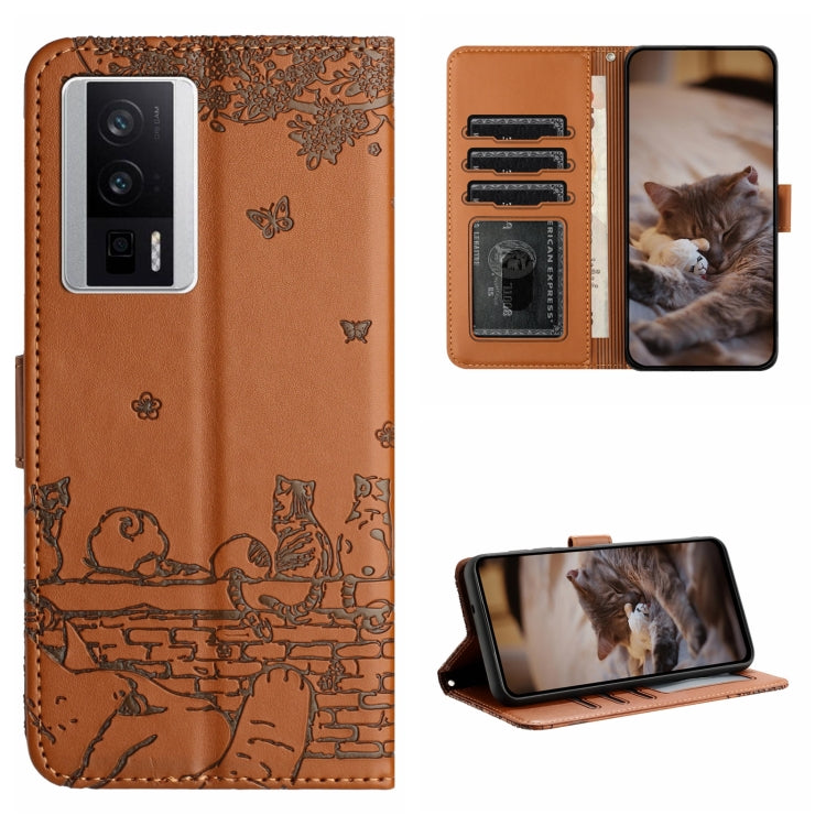 Brown cat-embossed leather-style folio phone case with lanyard and card slots.