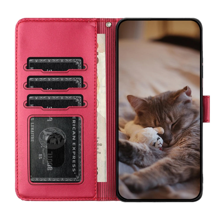 Red leather phone case with card slots and flip cover, cat embossed pattern.