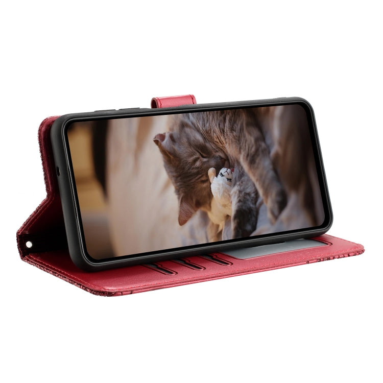 Red leather folio phone case with flip stand, cat pattern and lanyard loop.
