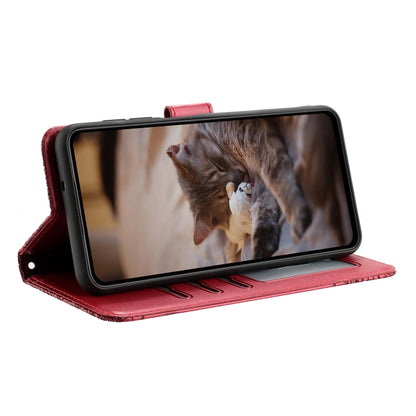 Red leather folio phone case with flip stand, cat pattern and lanyard loop.