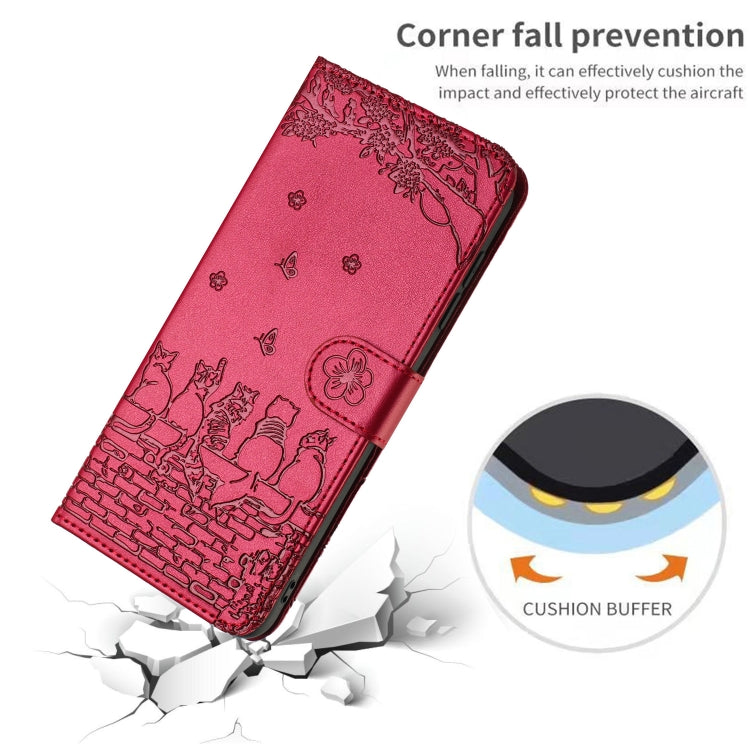 Red cat-embossed leather phone case lying angled, corner protection design.