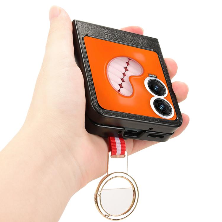 Black leather back phone case with ring holder, orange paw design, held in hand