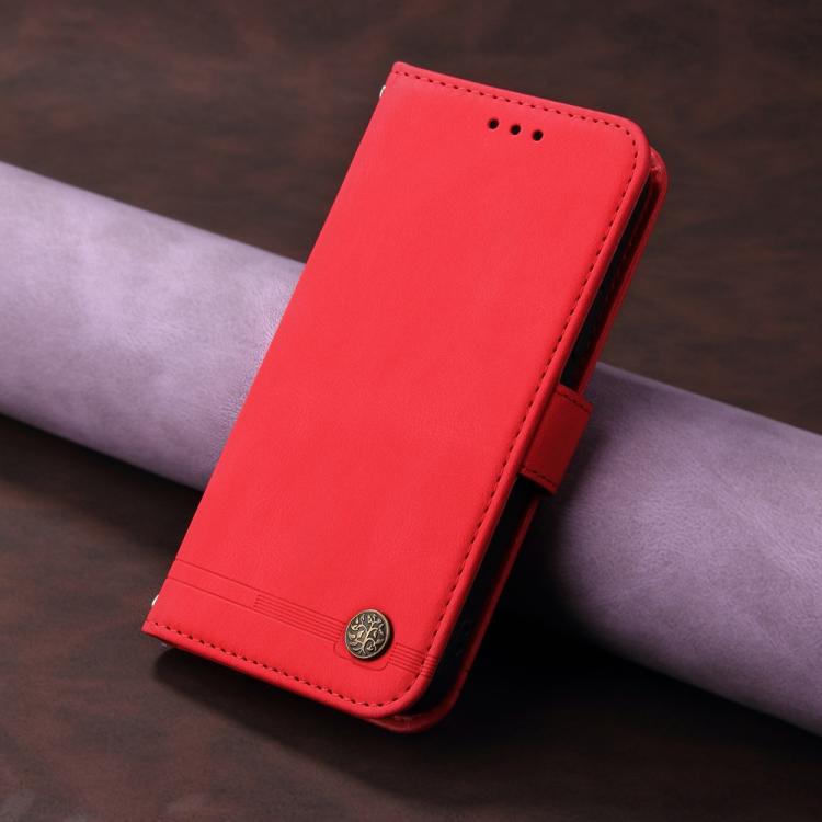 Red leather flip phone case with top speaker cutouts and round snap button.