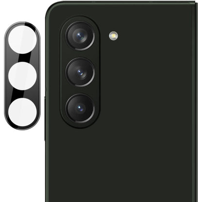 Black integrated glass lens film with cutouts for three rear camera lenses