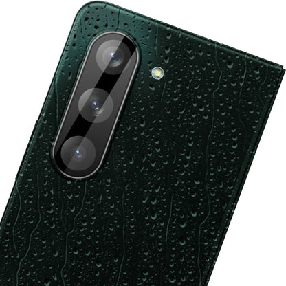 Dark green integrated glass lens film covering rear camera area with three lens cutouts