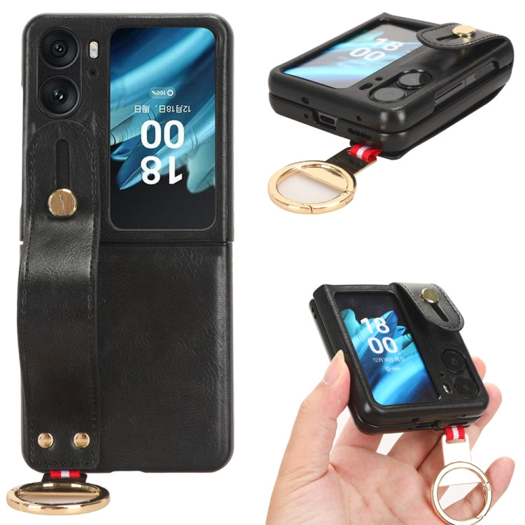 Black leather back phone case with camera cutout, wrist strap and gold keyring.