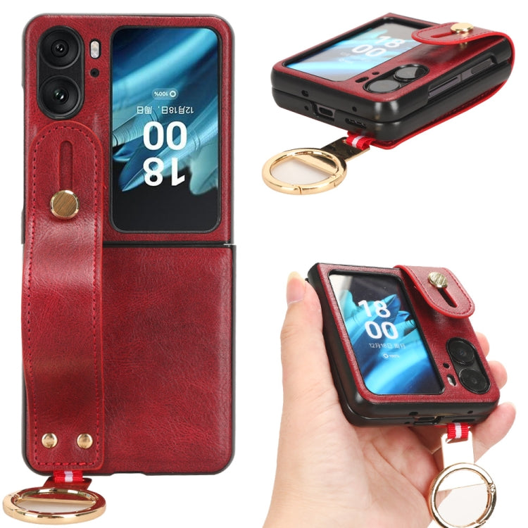 Red leather back phone case with camera cutout, wrist strap and gold keyring.