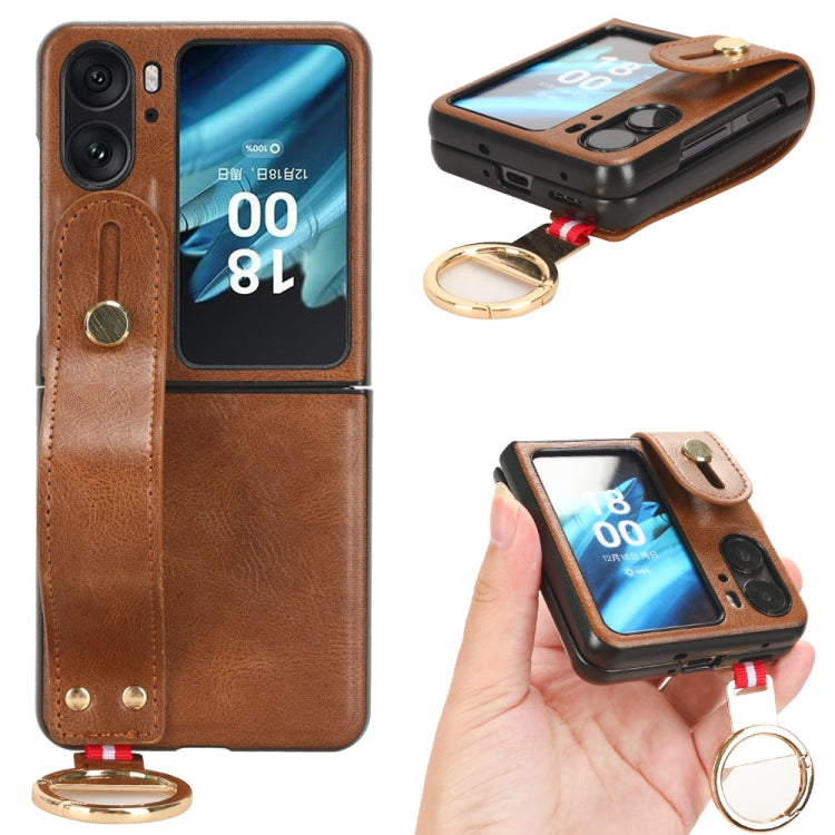 Brown leather back phone case with camera cutout, wrist strap and gold keyring.