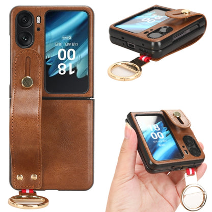 Brown leather back phone case with camera cutout, wrist strap and gold keyring.
