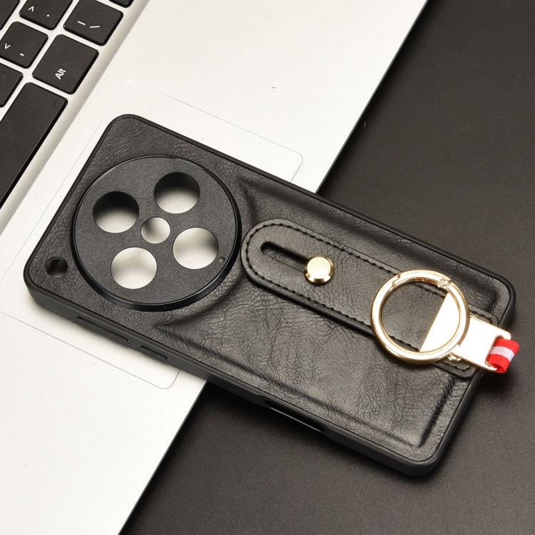 Black leather phone case with camera cutout and wrist strap with metal ring
