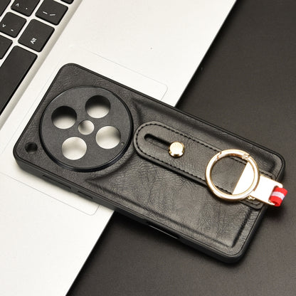 Black leather phone case with camera cutout and wrist strap with metal ring