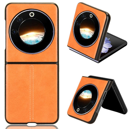 Textured flip phone case with round camera cutout, orange finish