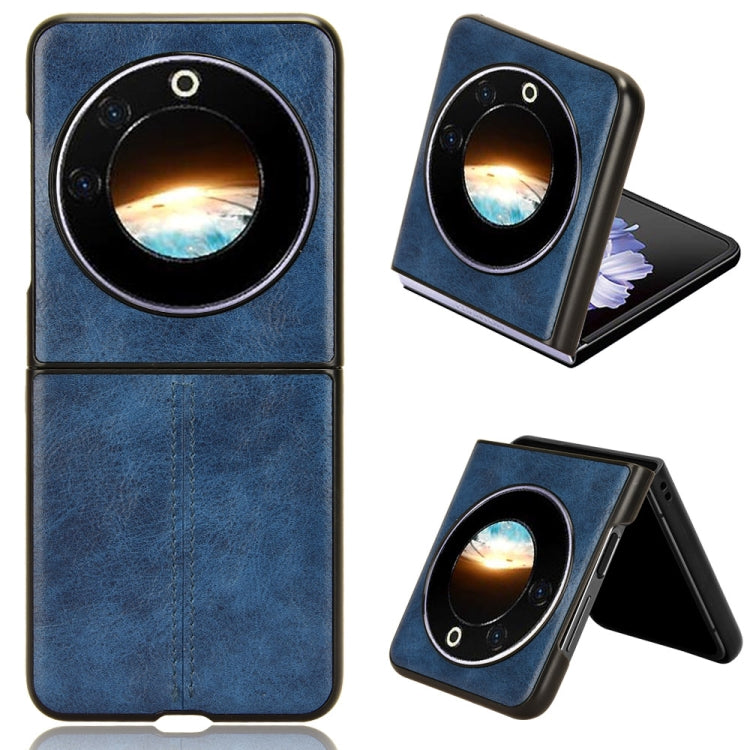 Textured flip phone case with round camera cutout, blue finish