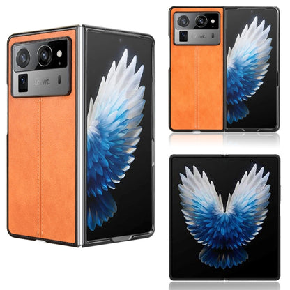 Textured flip phone case, orange and black with white-blue wing graphic panel