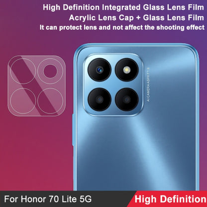 Phone back with four rear camera lenses covered by integrated glass lens film.