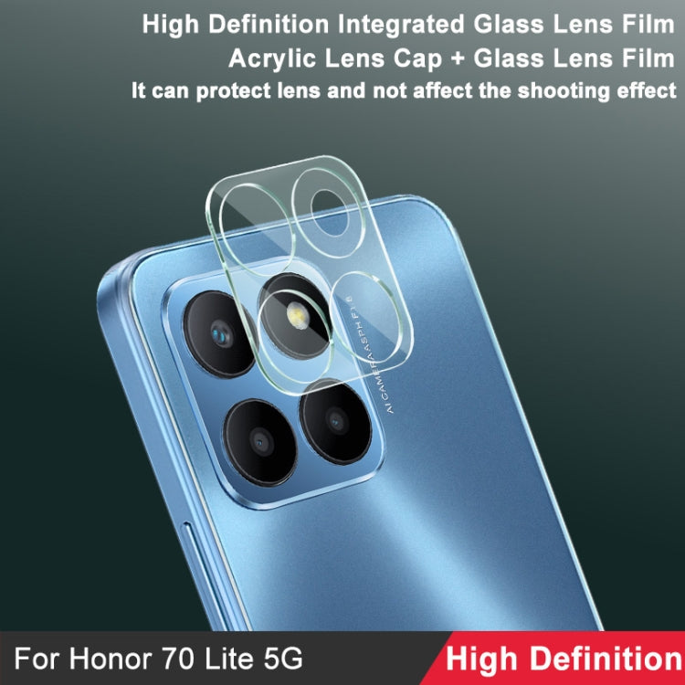 Phone back angled, integrated glass lens film covering four rear camera lenses.