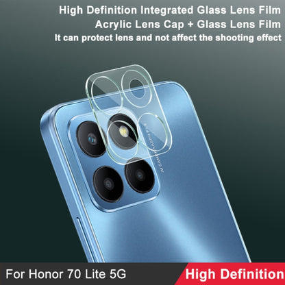 Phone back angled, integrated glass lens film covering four rear camera lenses.
