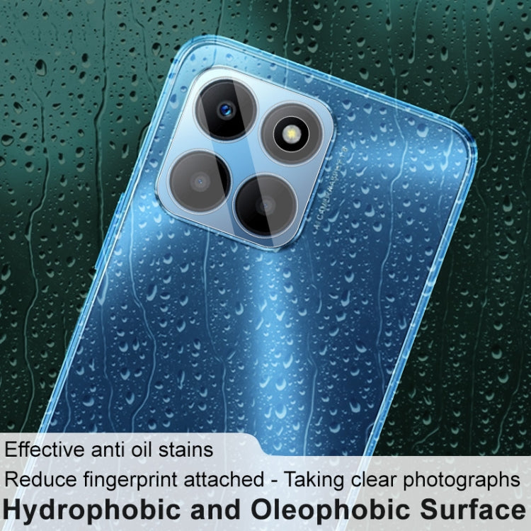 Clear glass lens film on a blue phone back, protecting rear camera lenses.