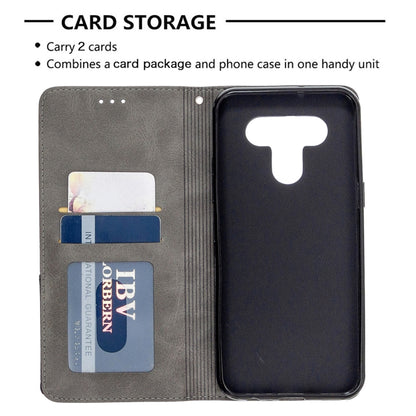 Grey flip phone wallet case with rhombus texture and card slots holding cards