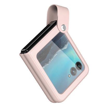Pink leather phone case with hand strap, window cutout, and camera openings.