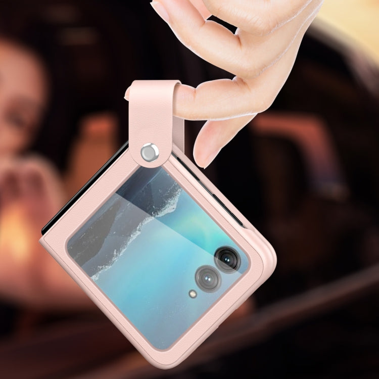 Light pink leather phone case with hand strap and camera cutouts.