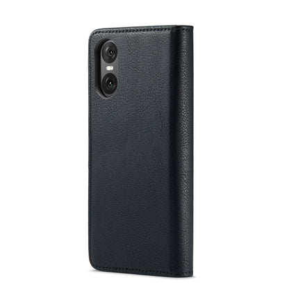 Black leather phone case with cutouts and textured finish