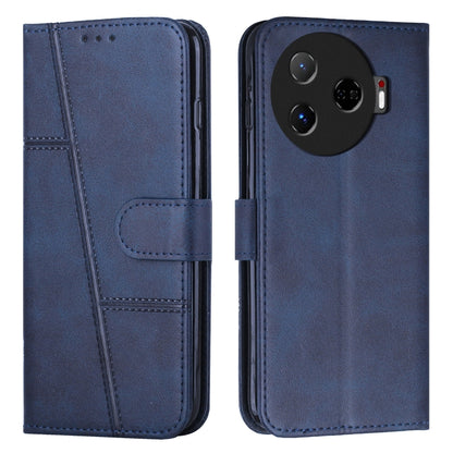 Navy blue leather phone case with buckle strap, stitched detailing, and folio cover