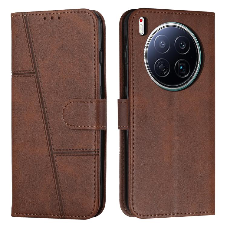 Brown buckle leather phone case with stitched panel, strap closure, card slot, large camera cutout