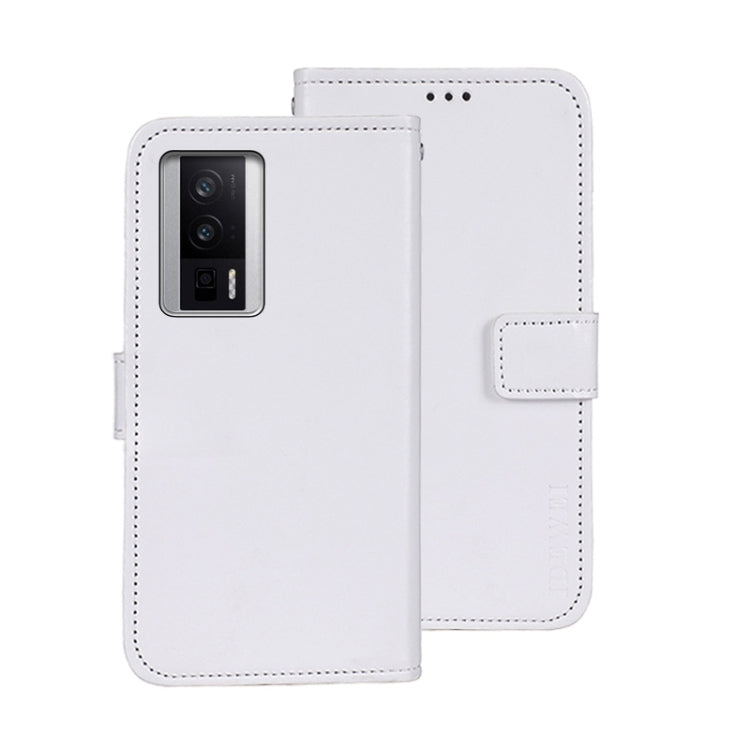 White leather wallet phone case with magnetic flap and camera cutout.
