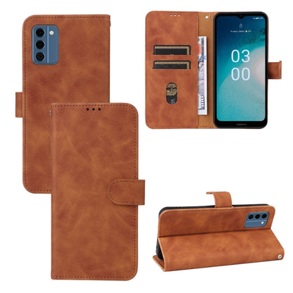 Brown magnetic flip leather phone case with card slots and magnetic closure