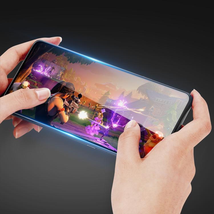 Tempered glass screen protector film, edge-to-edge fit applied to phone screen