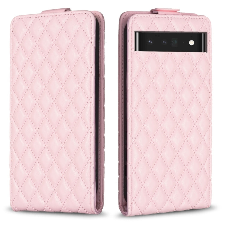 Light pink leather flip phone case with diamond lattice texture and camera cutout