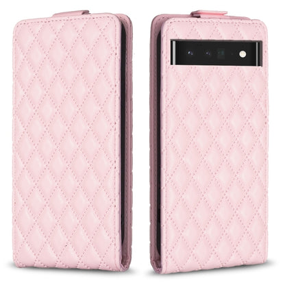 Light pink leather flip phone case with diamond lattice texture and camera cutout
