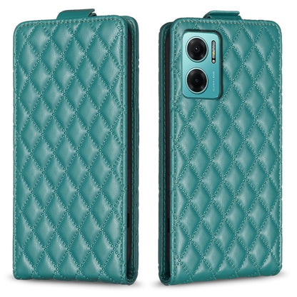 Teal leather flip phone case with diamond lattice texture and camera window