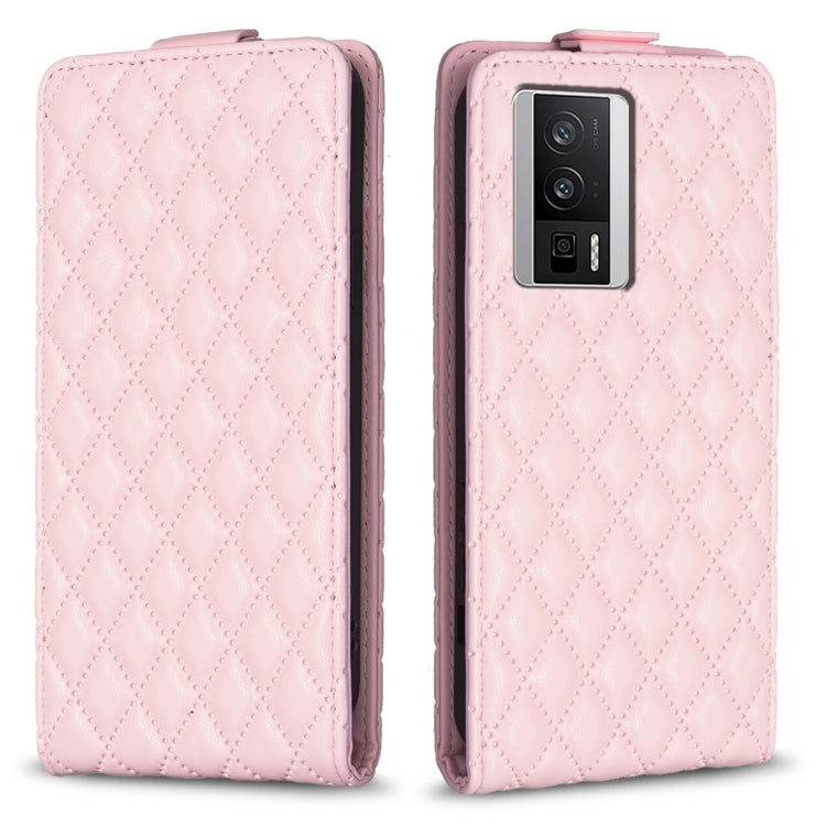 Pink leather flip phone case with diamond lattice texture and camera cutout