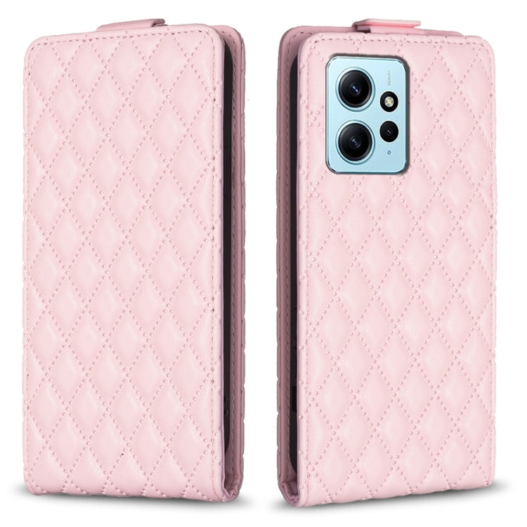 Pink leather flip phone case with diamond lattice pattern, front cover and phone camera view.
