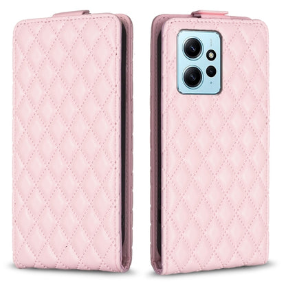 Pink leather flip phone case with diamond lattice pattern, front cover and phone camera view.