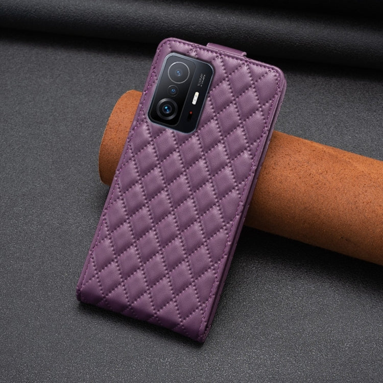 Dark purple diamond lattice leather flip phone case with camera cutout and stand
