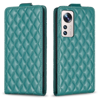 Teal diamond-lattice leather flip phone case with camera cutout and front flap