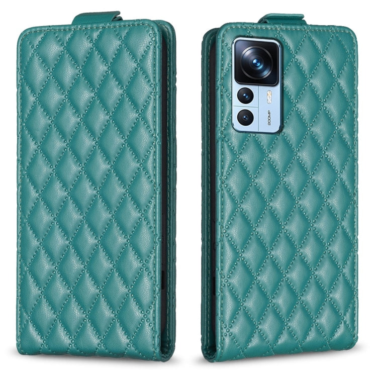 Teal green diamond-lattice leather flip phone case with camera cutout and folio flap