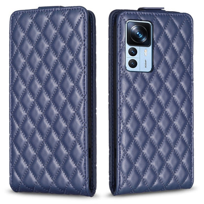 Navy blue diamond-lattice leather flip phone case with camera cutout and folio flap